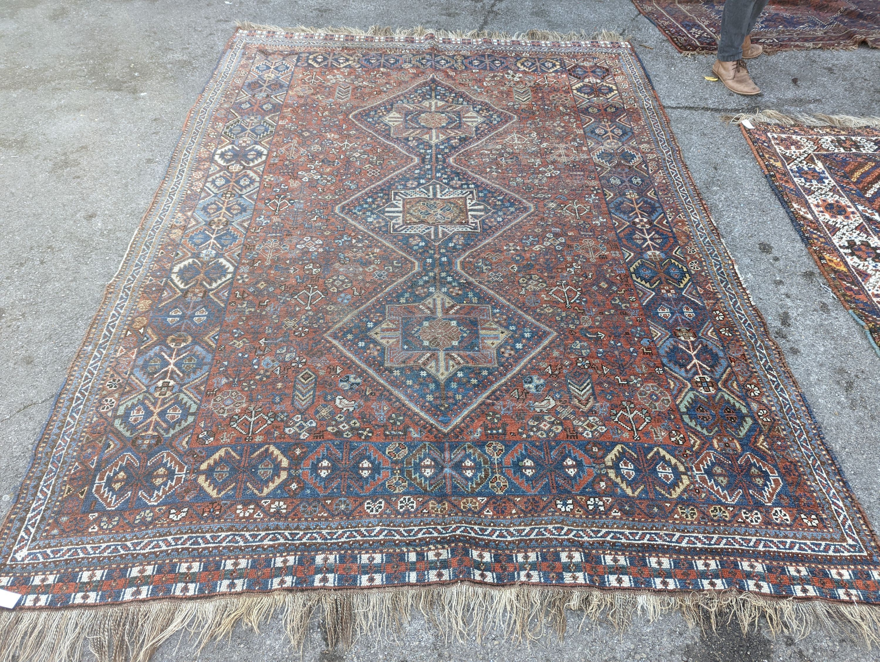 A Caucasian red ground carpet, 295 x 220cm